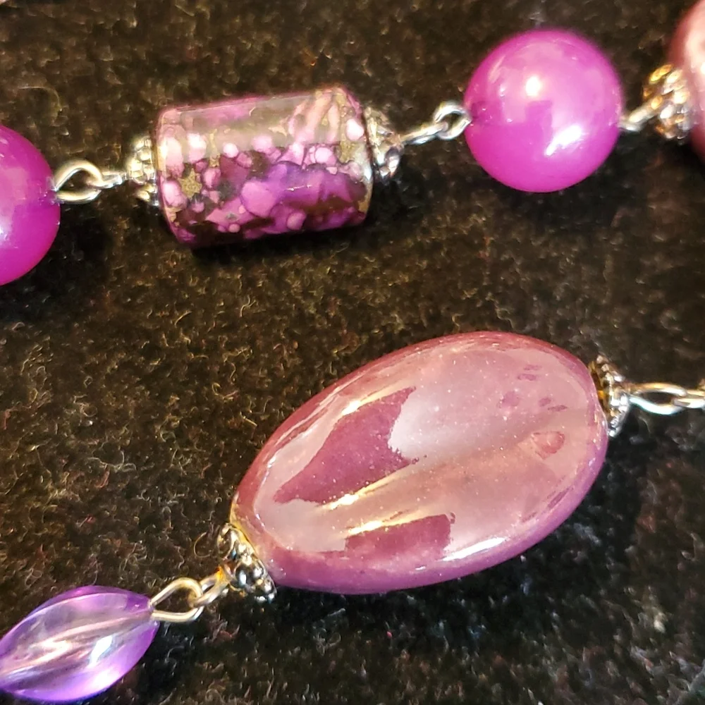 Gunmetal double strand necklace with purple seed bead bows and marble look beads